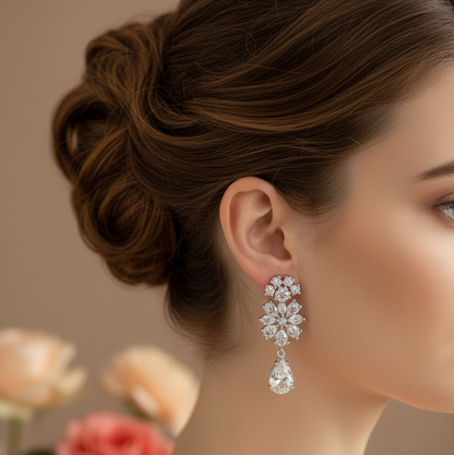 Close-up of a woman wearing a diamond earring with flowers in the background